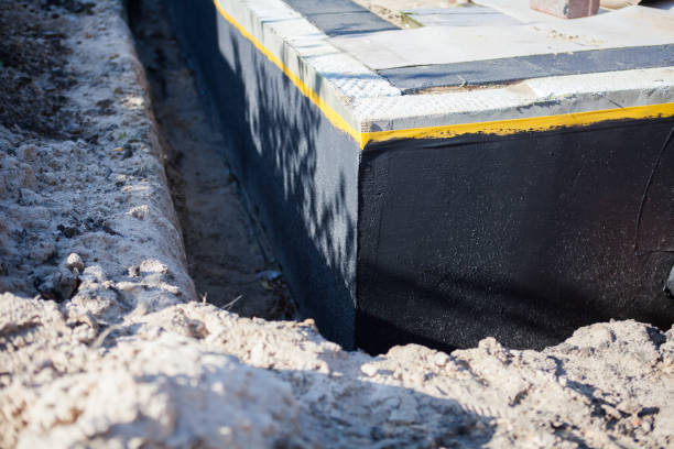 Professional Waterproofing technician working in Beaverton, MI